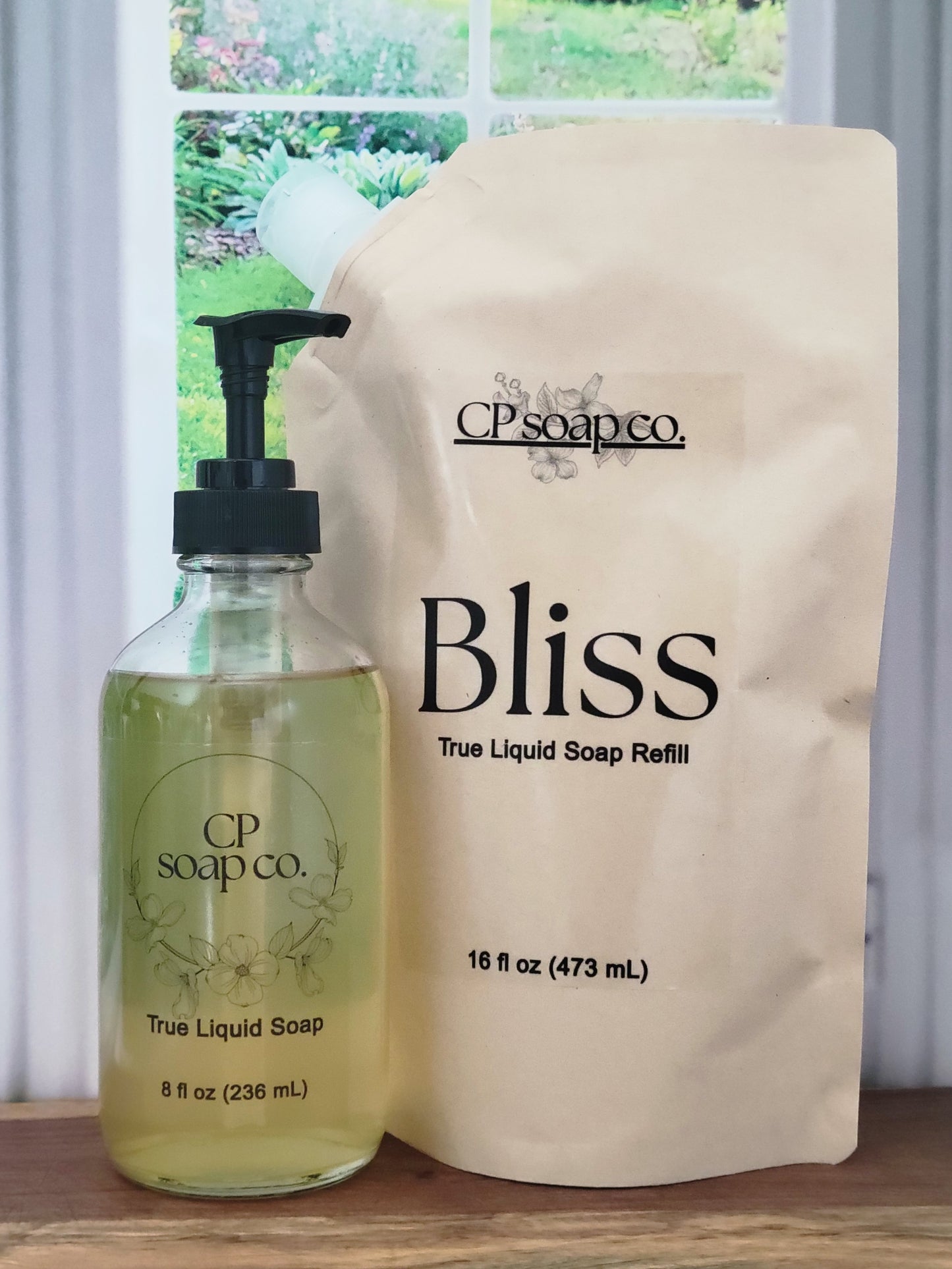 16 fl oz refill pouch and full 8oz glass pump bottle